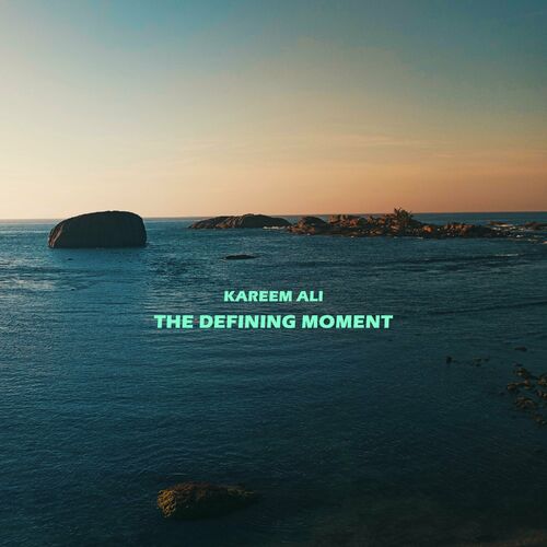 image cover: Kareem Ali - The Defining Moment on CosmoFlux